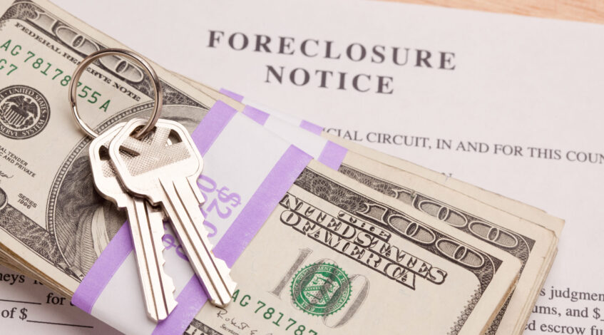 Foreclosure notice with money and keys