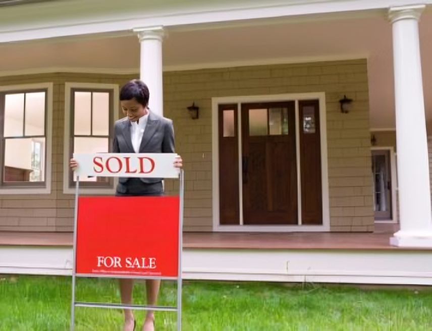 Sold sign in front of new home