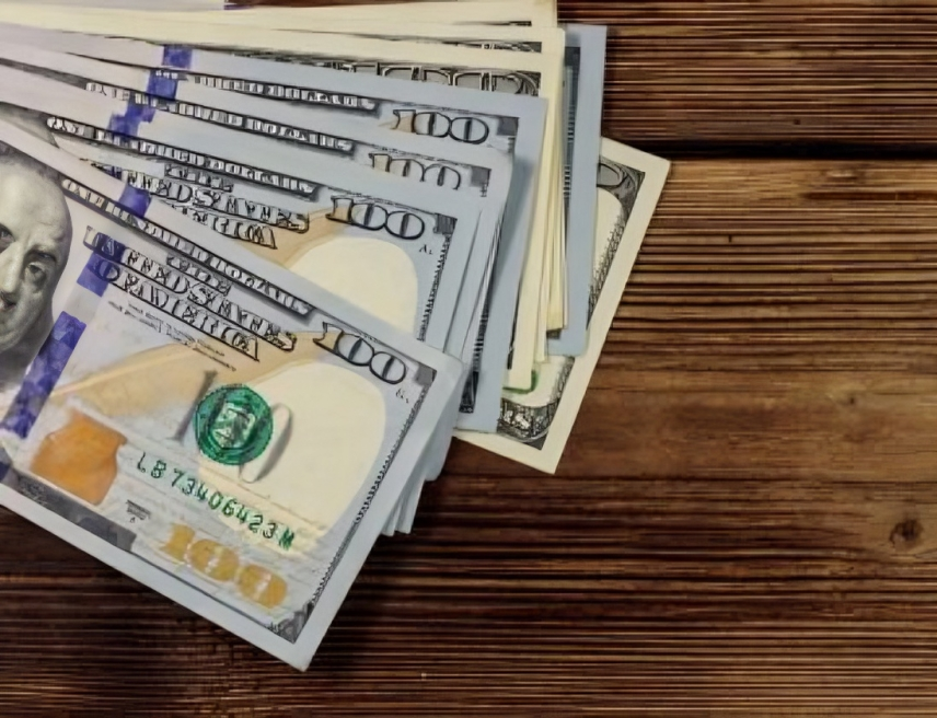 Hundred dollar bills fanned out